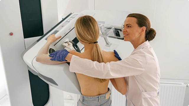 Close-up of a woman scratching a red, irritated rash on the side of her neck and lower face.